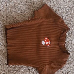 it’s very cute mushroom top! fits well my girl loves it but too small now!